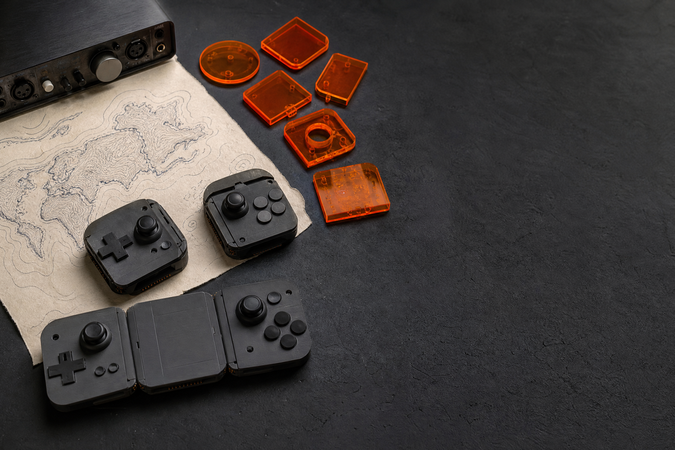Game development research materials arranged on a studio table